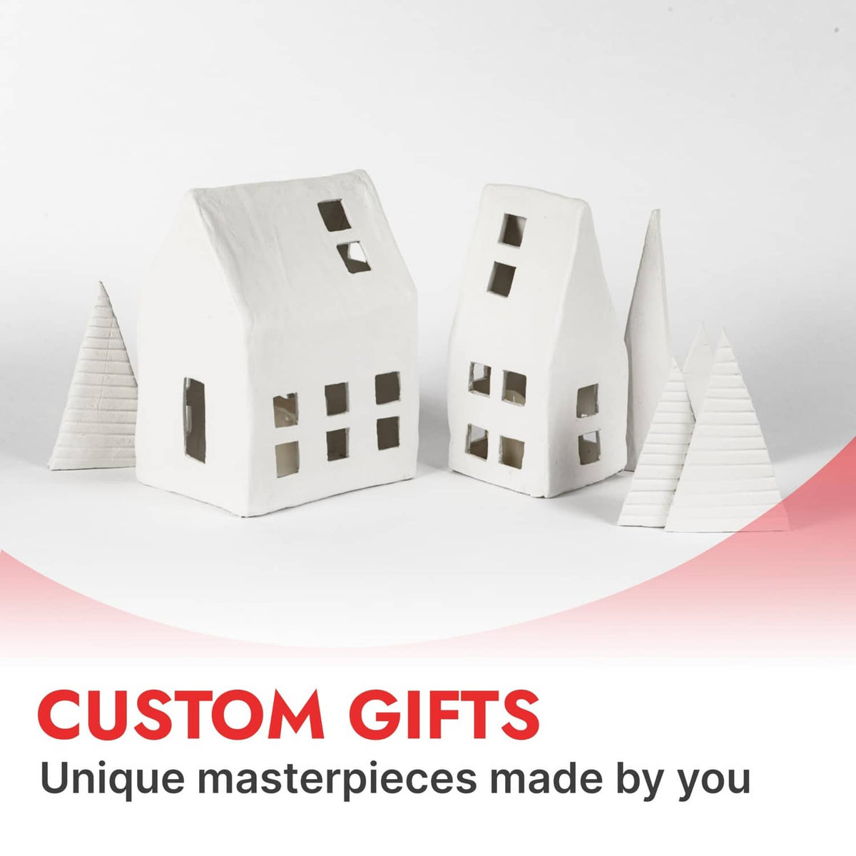 Air-dry clay custom houses: white miniature buildings with window cutouts