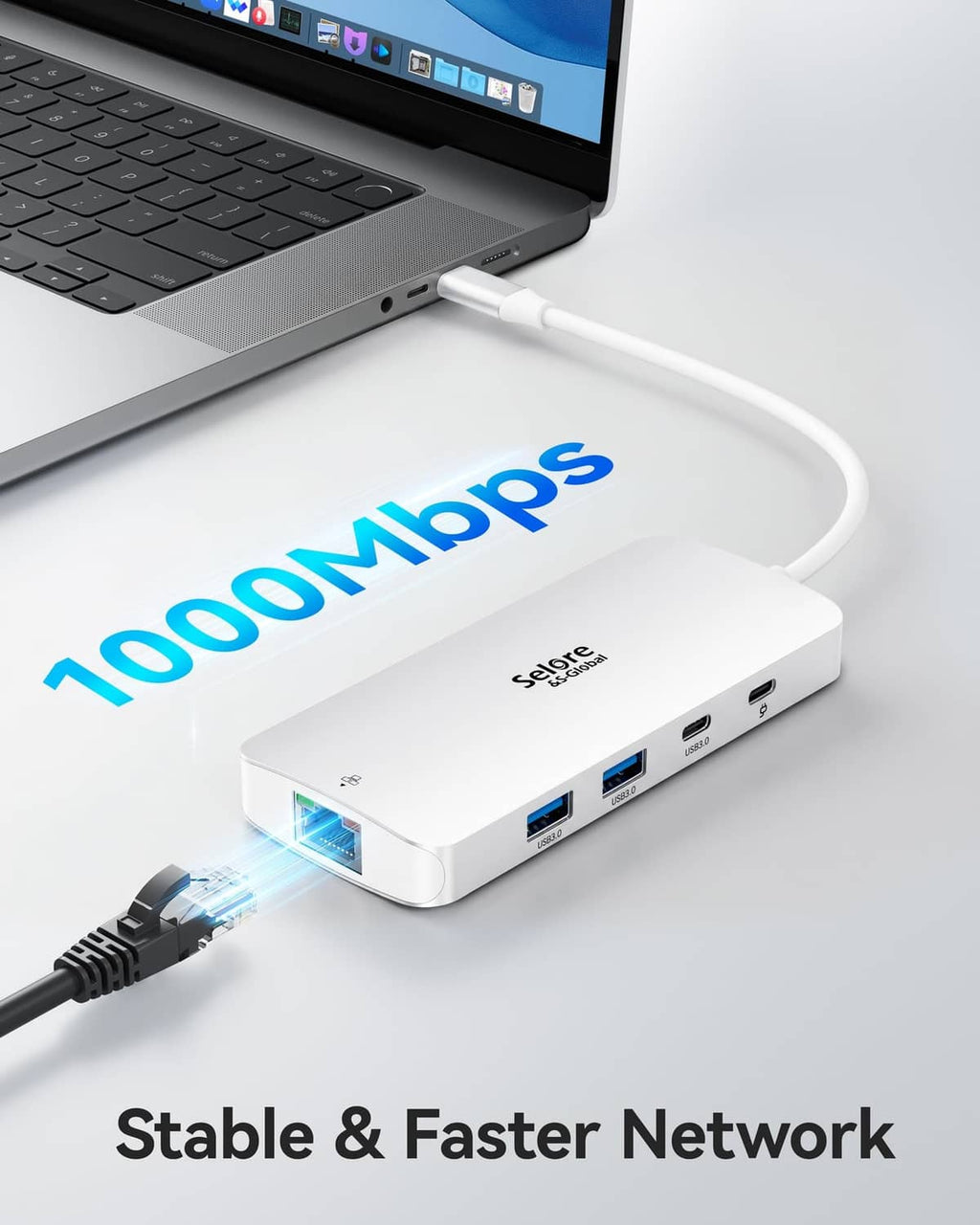 Silver USB-C docking station with LAN and USB ports connected to a laptop