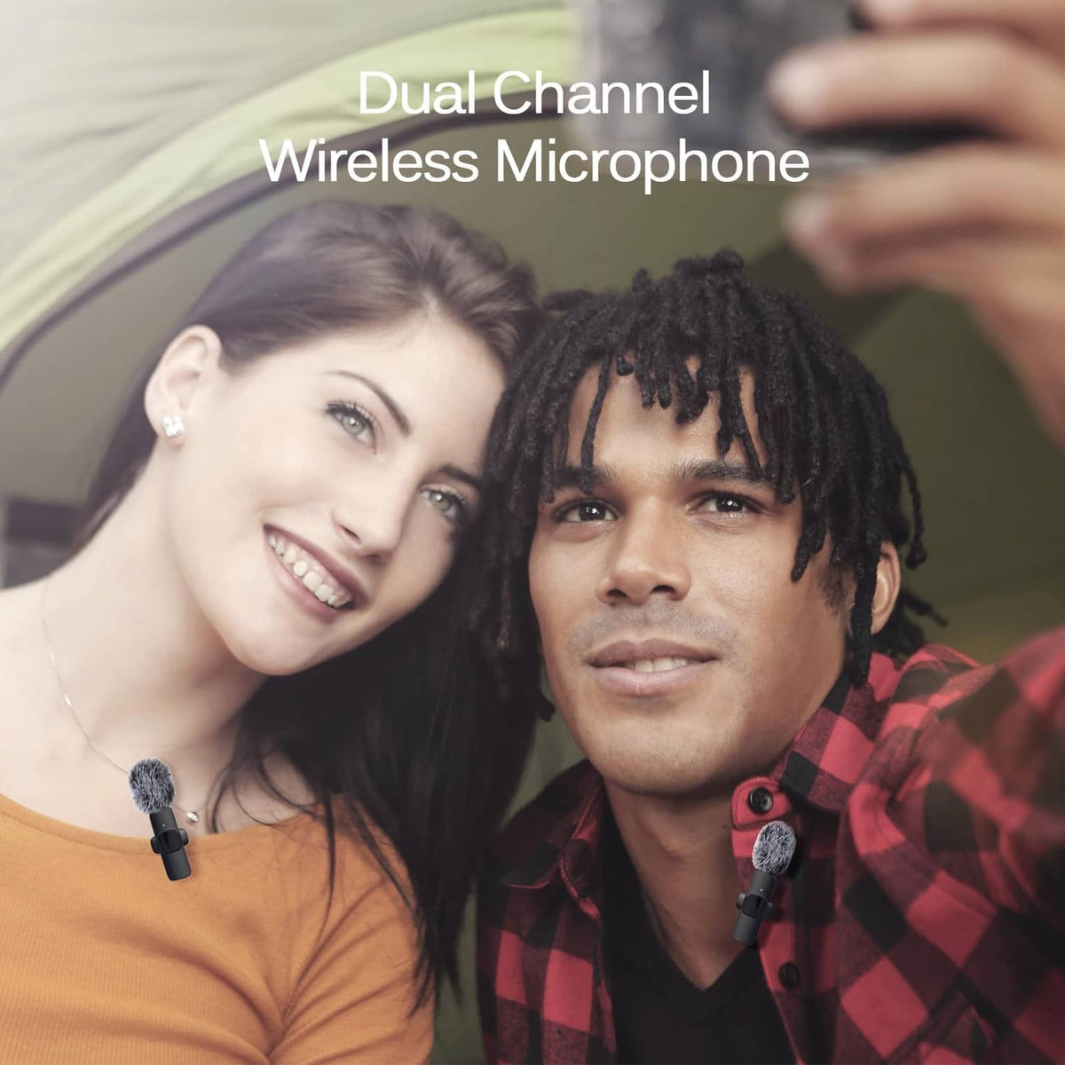 Wireless lavalier lapel microphones with furry windscreens clipped to two people