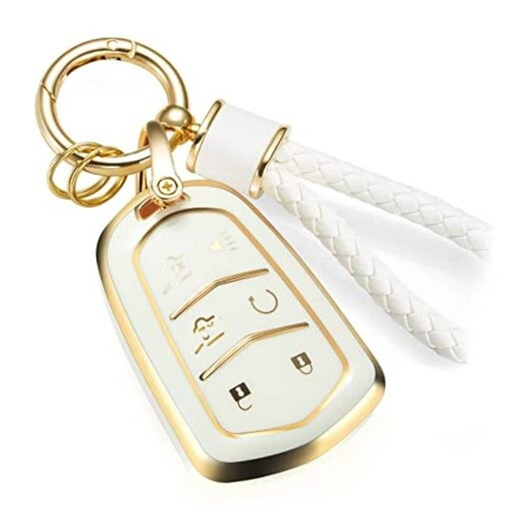 White key fob cover with gold trim and braided strap on a gold key ring