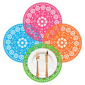 Colorful circular Mexican paper place mats with pink, blue, orange, and green patterns