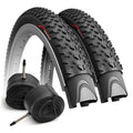 Pair of black mountain bike tires with folded inner tubes and Presta valves