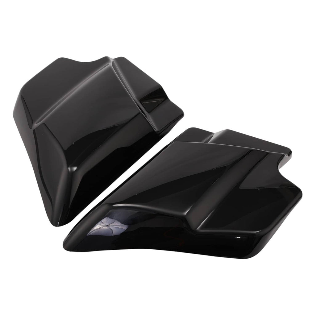 Black motorcycle side cover panels, angled view of matching pair with vented shape