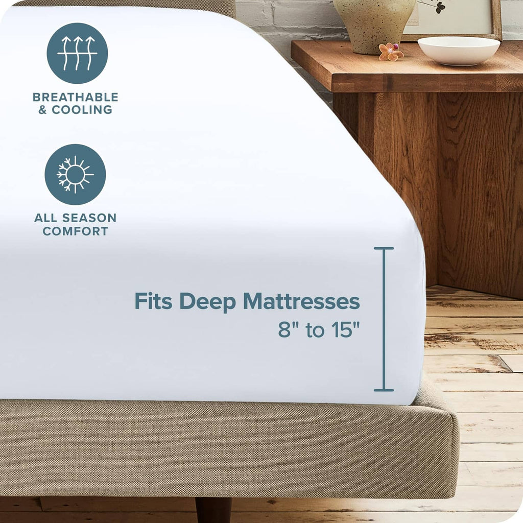 White fitted sheet on bed, designed for deep mattresses (8 to 15 in)