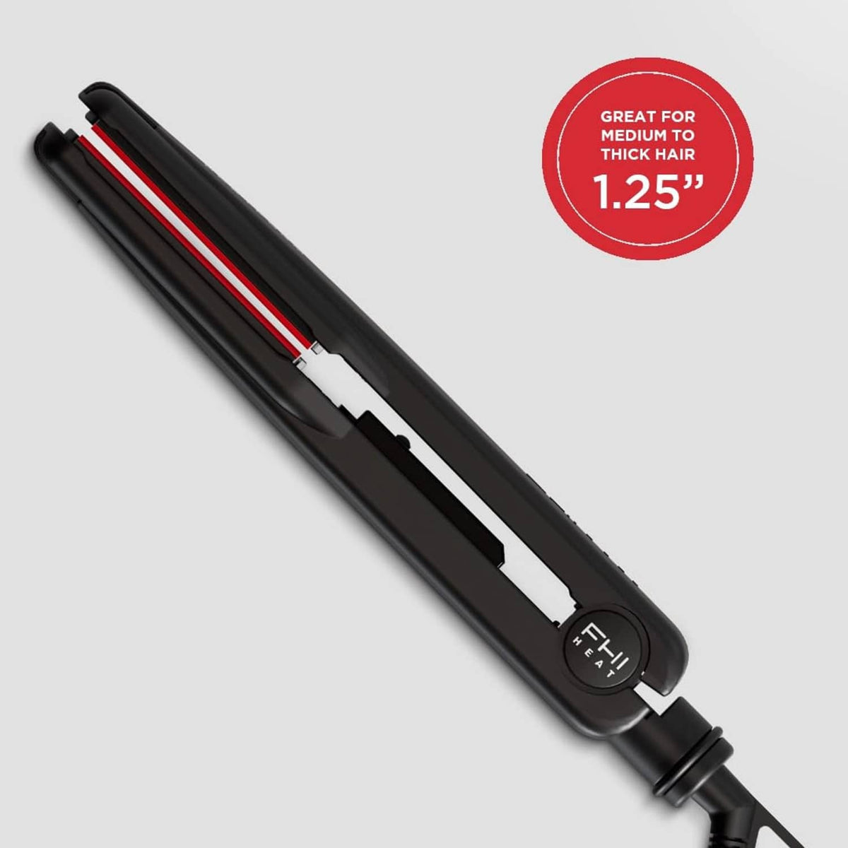 Hair straightener opened view with red heating plates and black body controls
