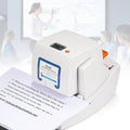 White electric stapler machine with orange button, loading tray and paper stack