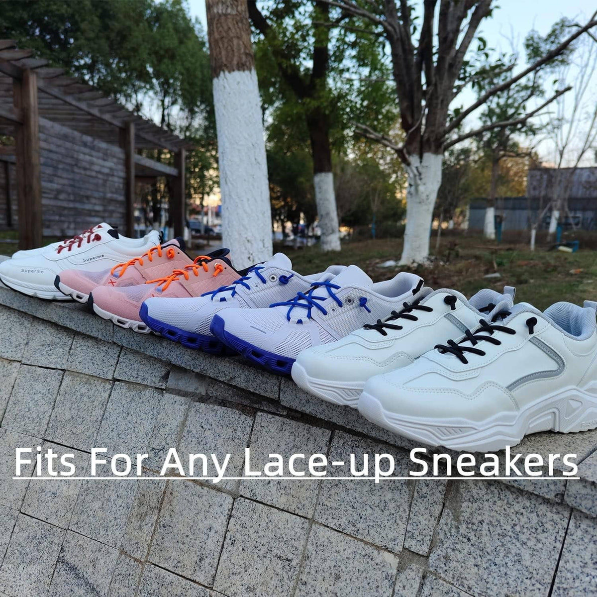 Elastic laces on lace-up sneakers in multiple colors on outdoor steps