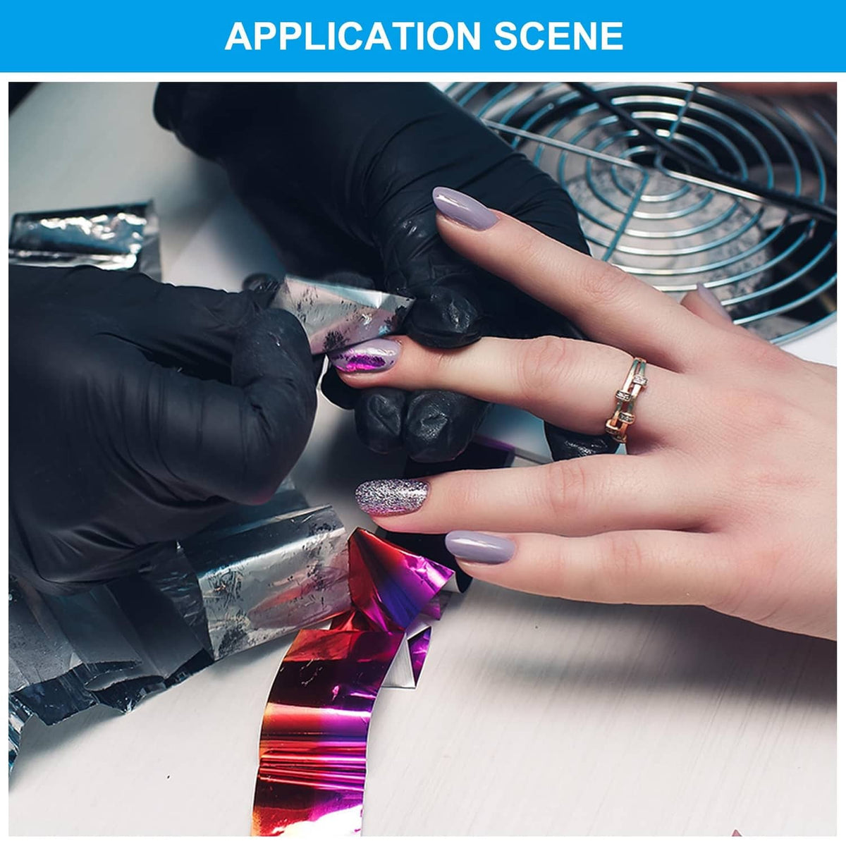 Gloved hands applying hot stamping foil pieces onto a surface