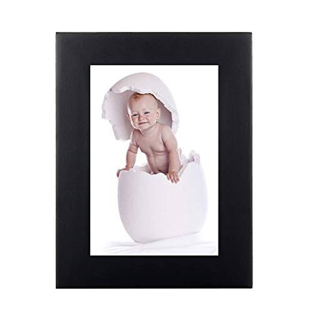 Black wood picture frame with portrait photo in a white mat and clear front