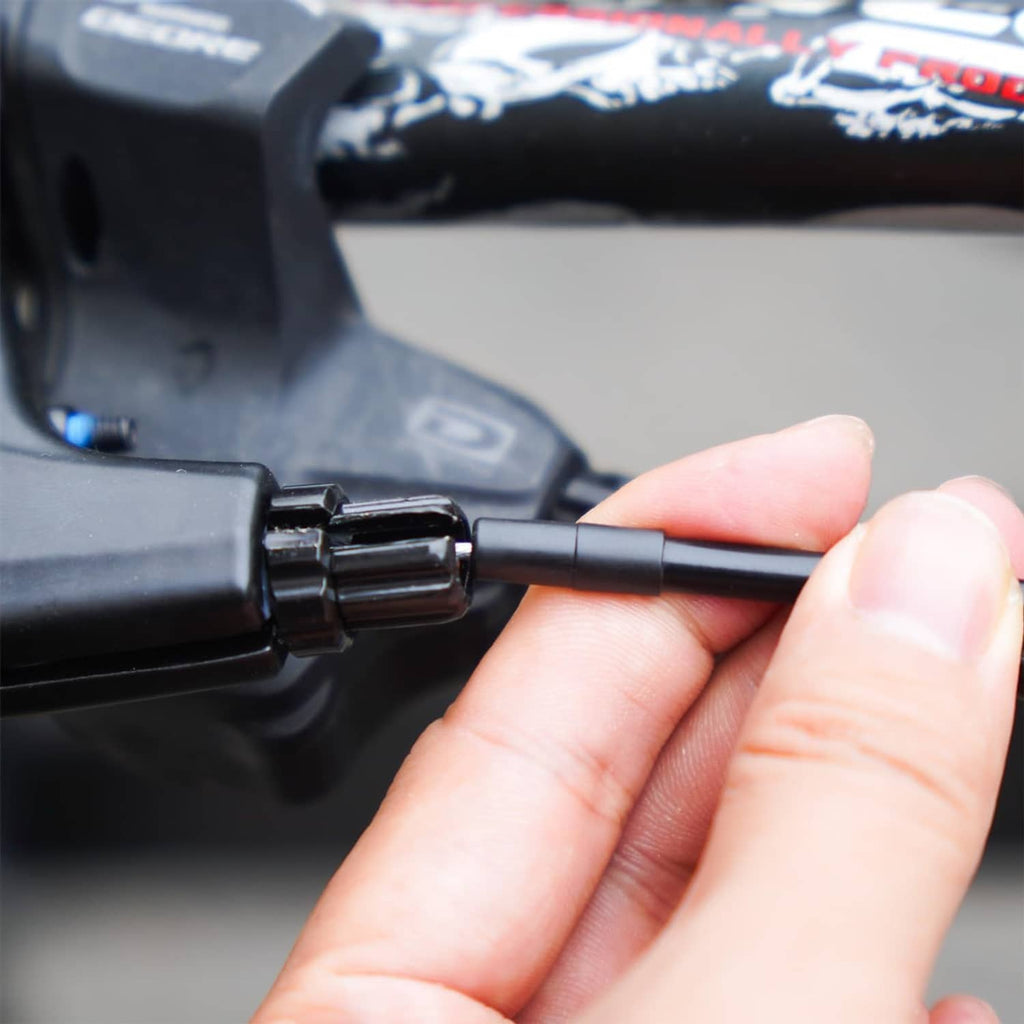 Brake cable installation tool with wire end inserted into a connector