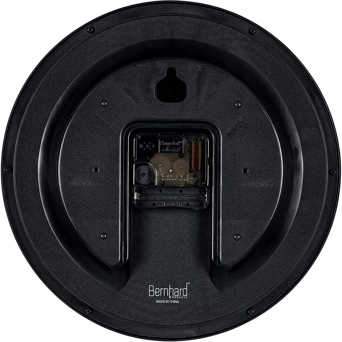 Back of black wall clock showing inner mechanism and mounting cover
