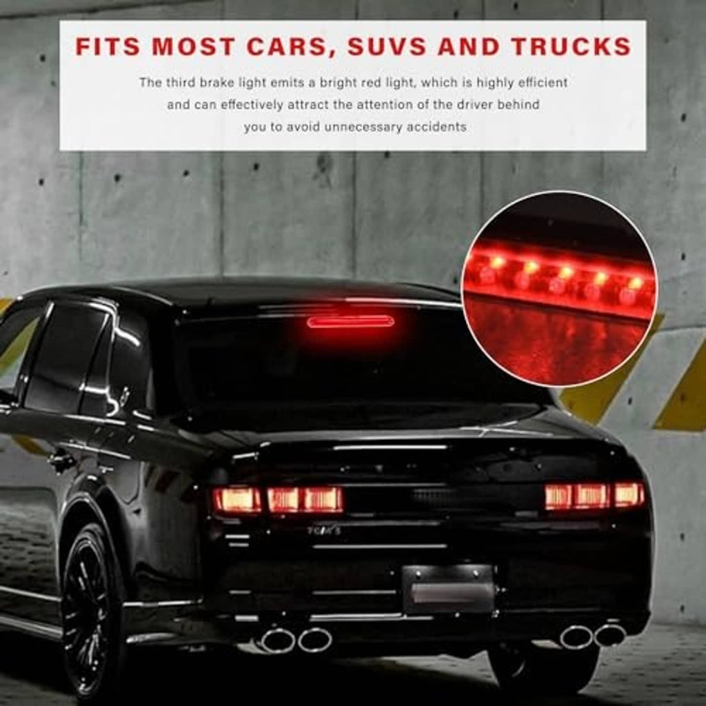 Red third brake light illuminated on a car trunk, high center mount