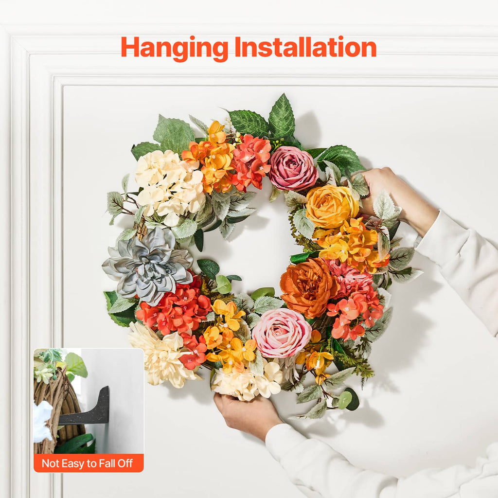 Hanging floral wreath with welcome sign, orange red yellow roses and hydrangeas