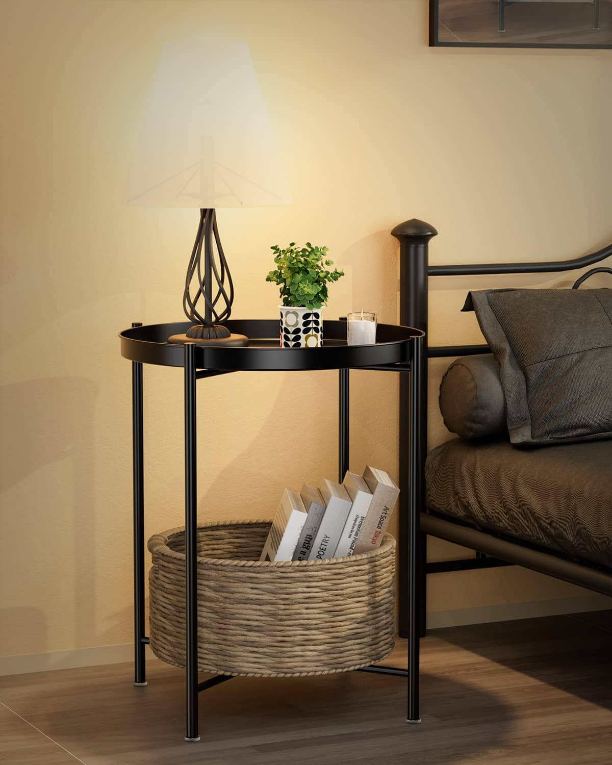 Black metal round side table with open lower shelf, used with woven storage basket