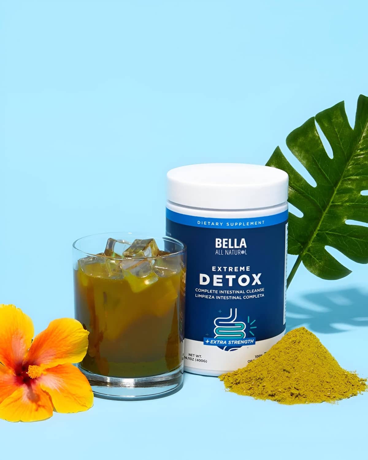 Bella Extreme Detox supplement jar with scoop and orange flower