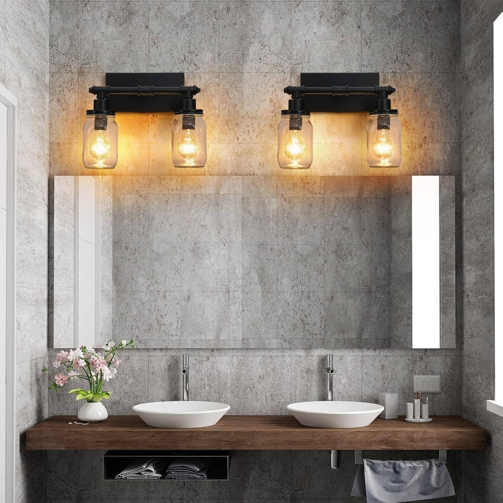Two black 2-light vanity bars with four clear mason-jar shades on wall