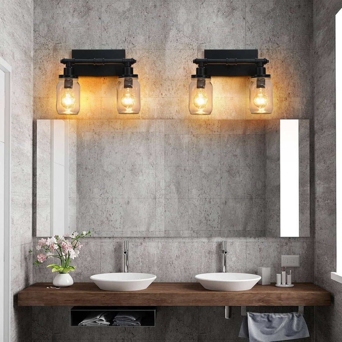 Two black 2-light vanity bars with four clear mason-jar shades on wall