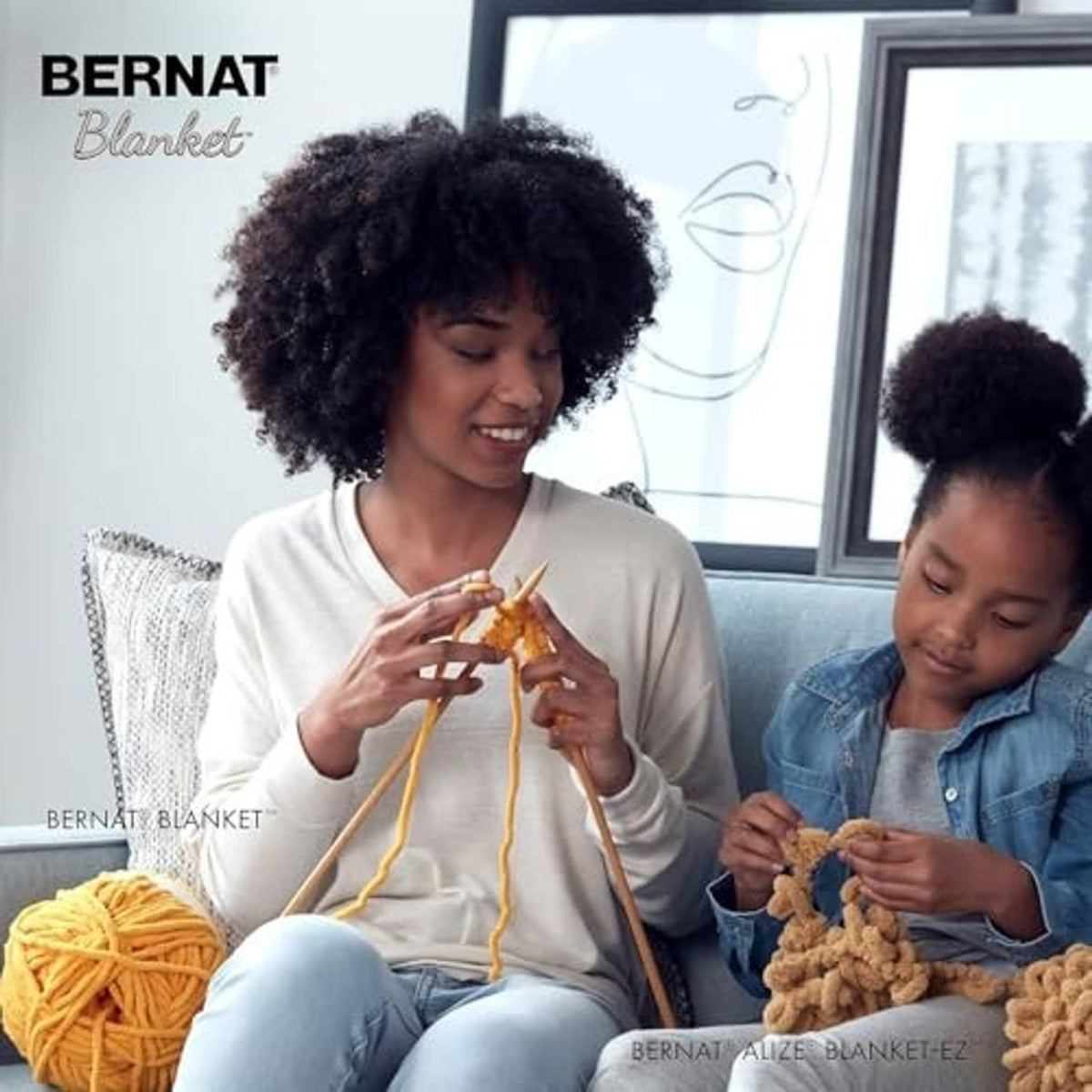People crafting with super bulky chenille yarn balls and crochet projects