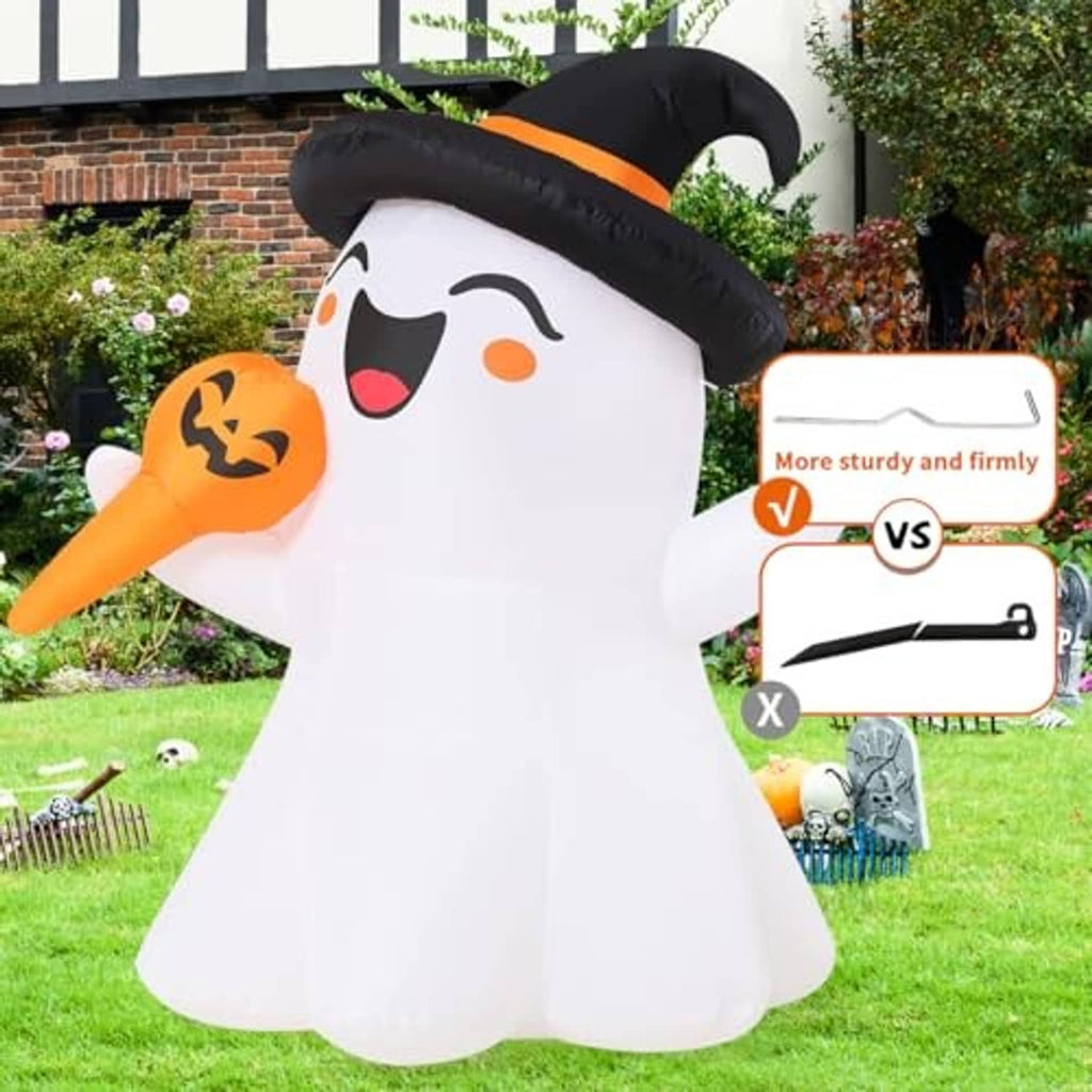 White inflatable ghost with black witch hat and orange jack-o-lantern, standing on lawn