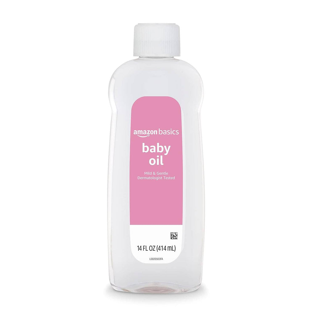Baby oil bottle, white plastic with pink Amazon Basics label, front view, 14 fl oz (414 ml)