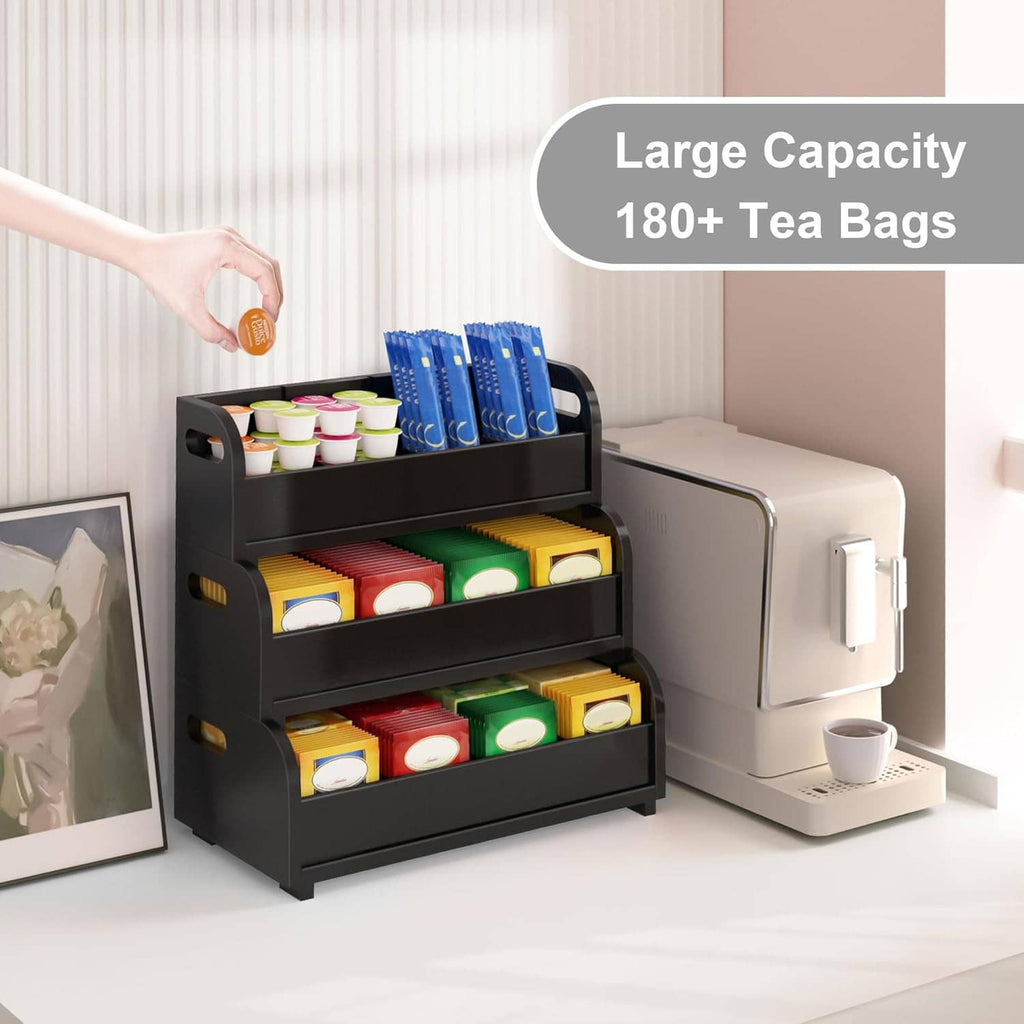 Black 3-tier tea bag organizer with open shelves holding tea bags and containers