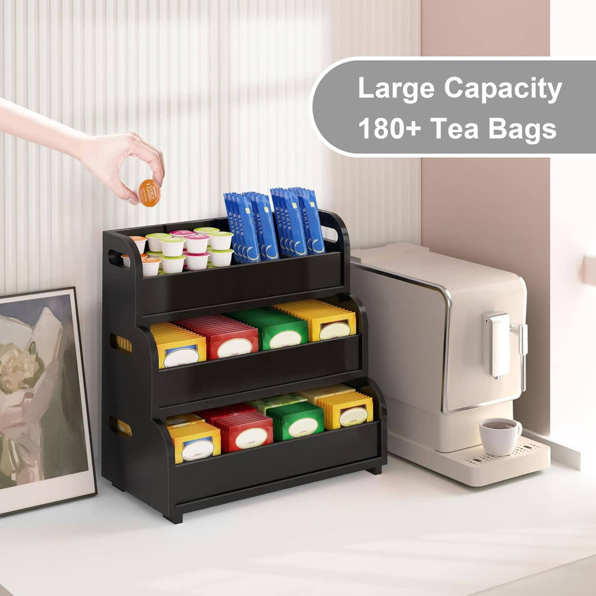 Black 3-tier tea bag organizer with open shelves holding tea bags and containers