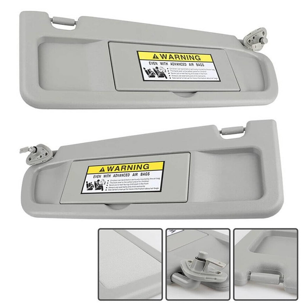 Gray driver and passenger side sun visors with warning label and mounting bracket