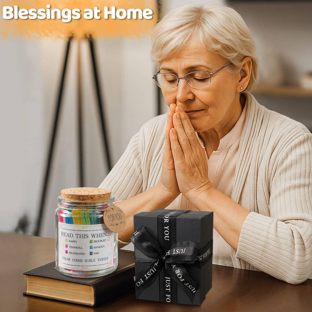 Prayer verse jar with cork lid on table beside black gift box