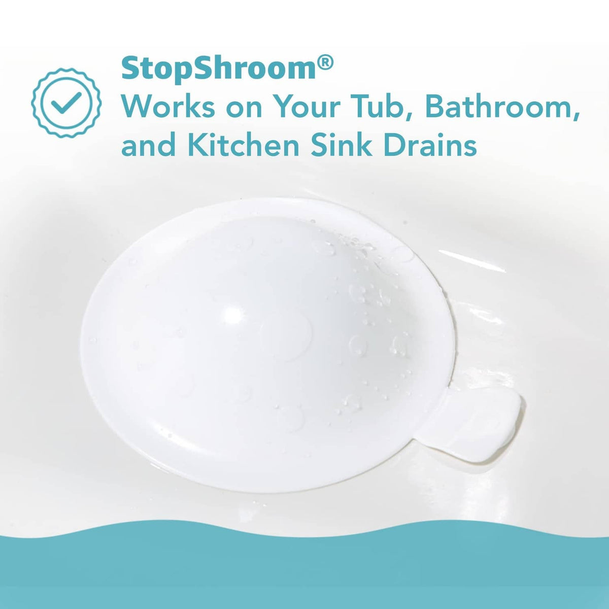 White silicone mushroom drain stopper plug seated over sink drain