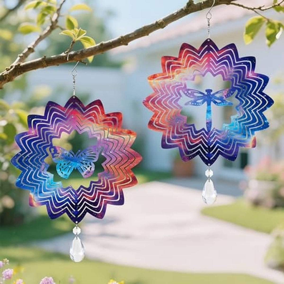 Two multicolor 3D butterfly wind spinners hanging with clear teardrop pendants