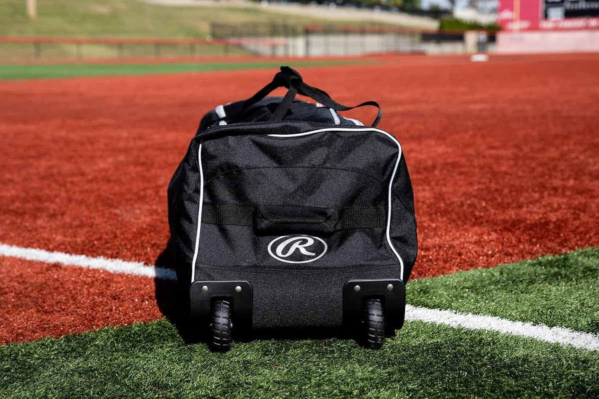 Black wheeled catcher’s bag back panel with R mark and two caster wheels