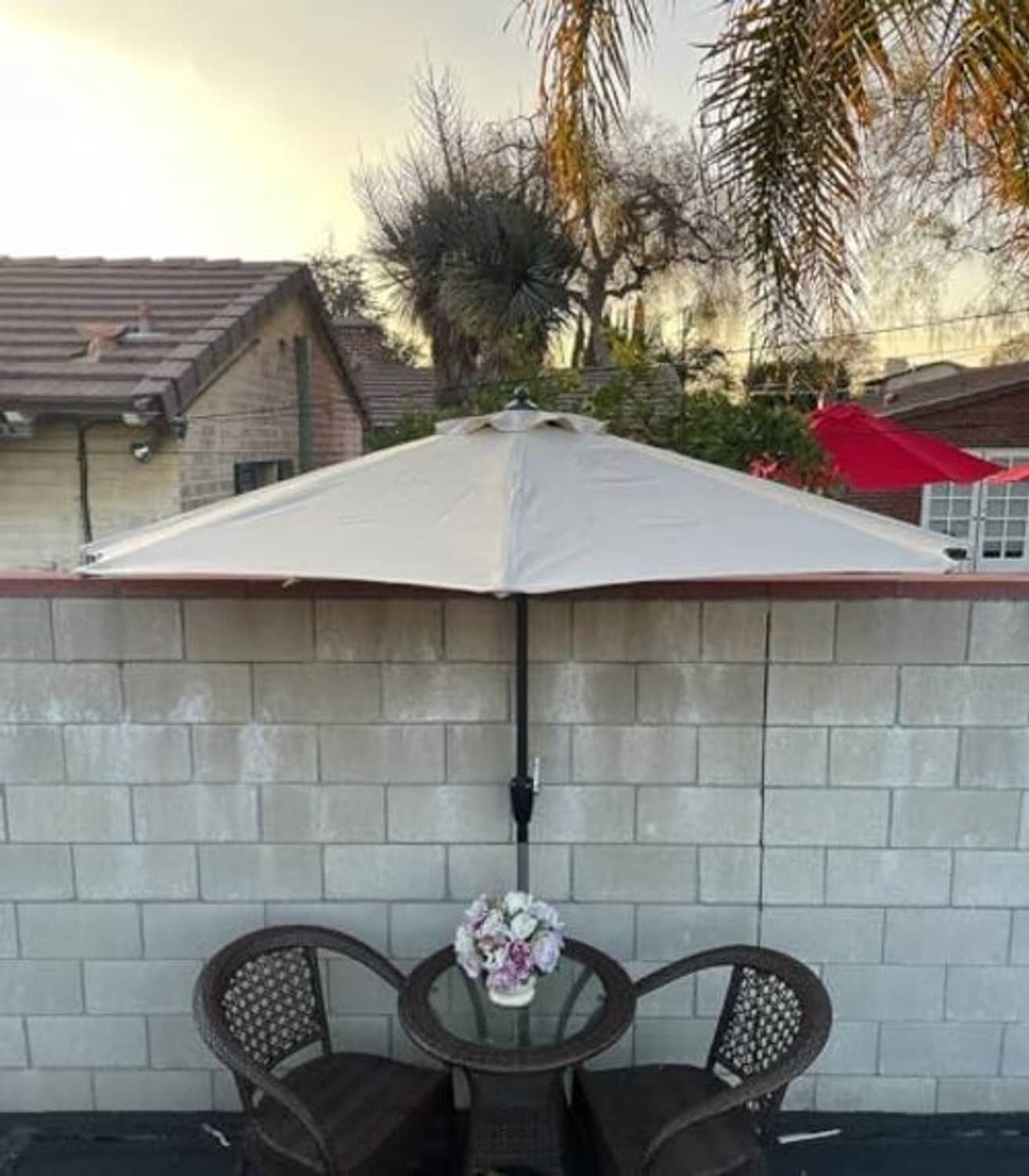 Light gray umbrella canopy with central pole and pleated fabric panels