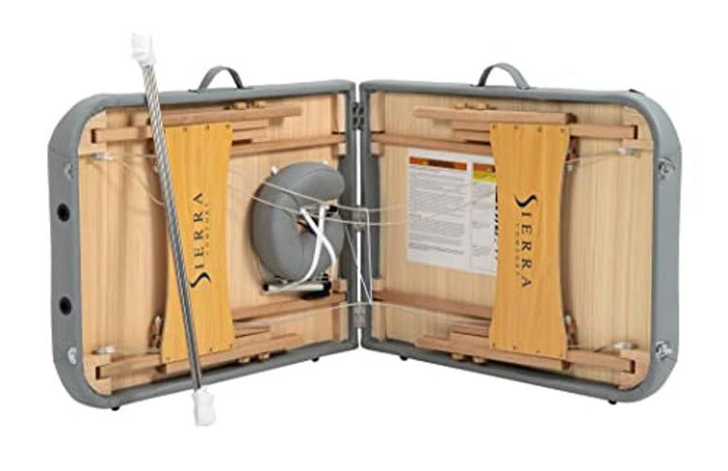 Open gray carrying case for portable massage table, showing wooden frame and padding