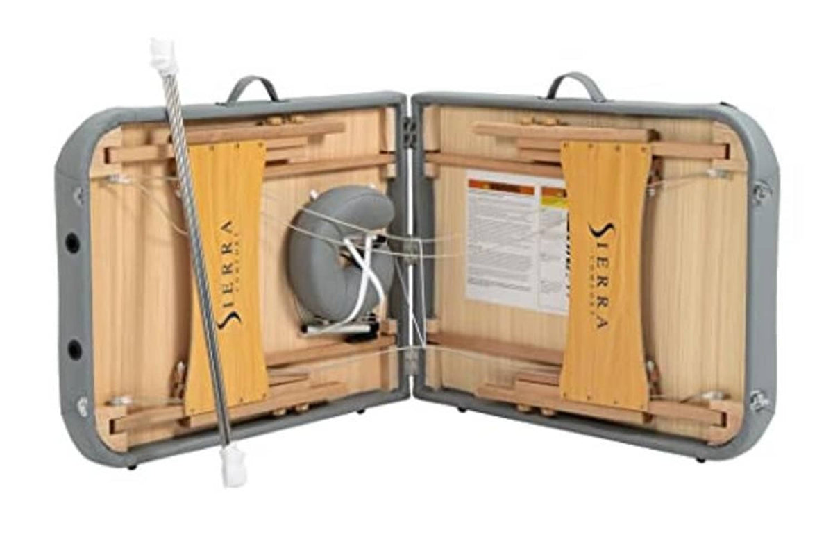Open gray carrying case for portable massage table, showing wooden frame and padding