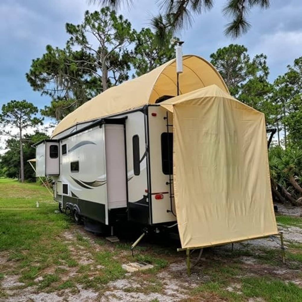 Sand sun shade cloth shelter attached to an RV doorway with support poles