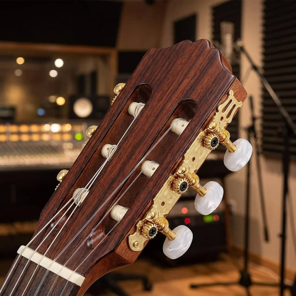Gold tuning pegs with white knobs on classical guitar headstock, mounted on dark wood