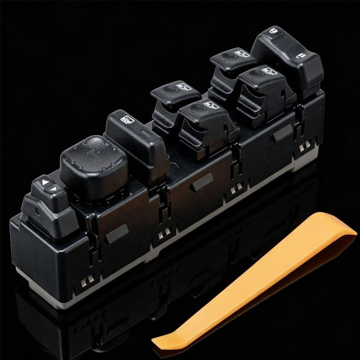 Black power window switch module with window buttons and orange release tab