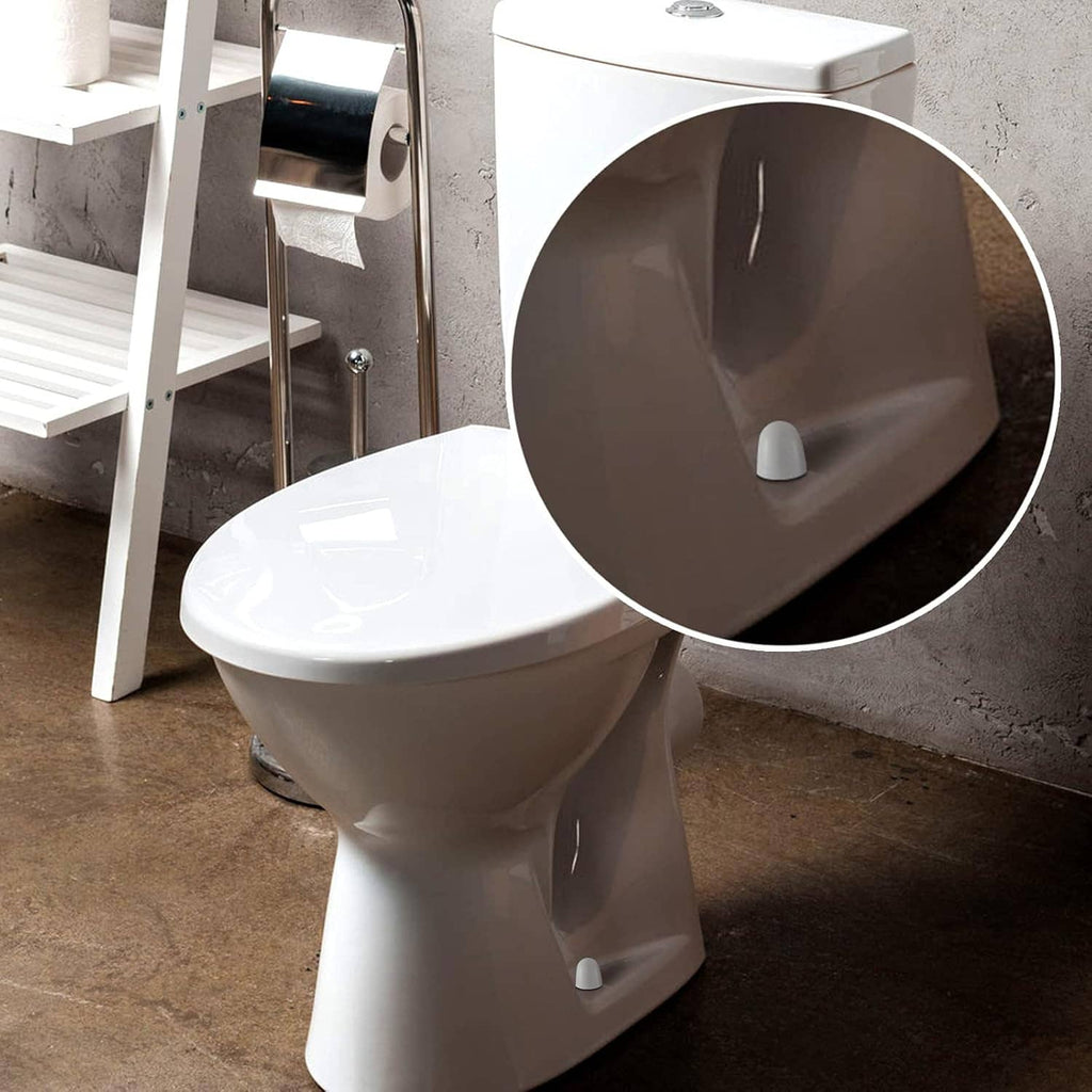 White toilet bolt cap covers on toilet base, round push-on fit