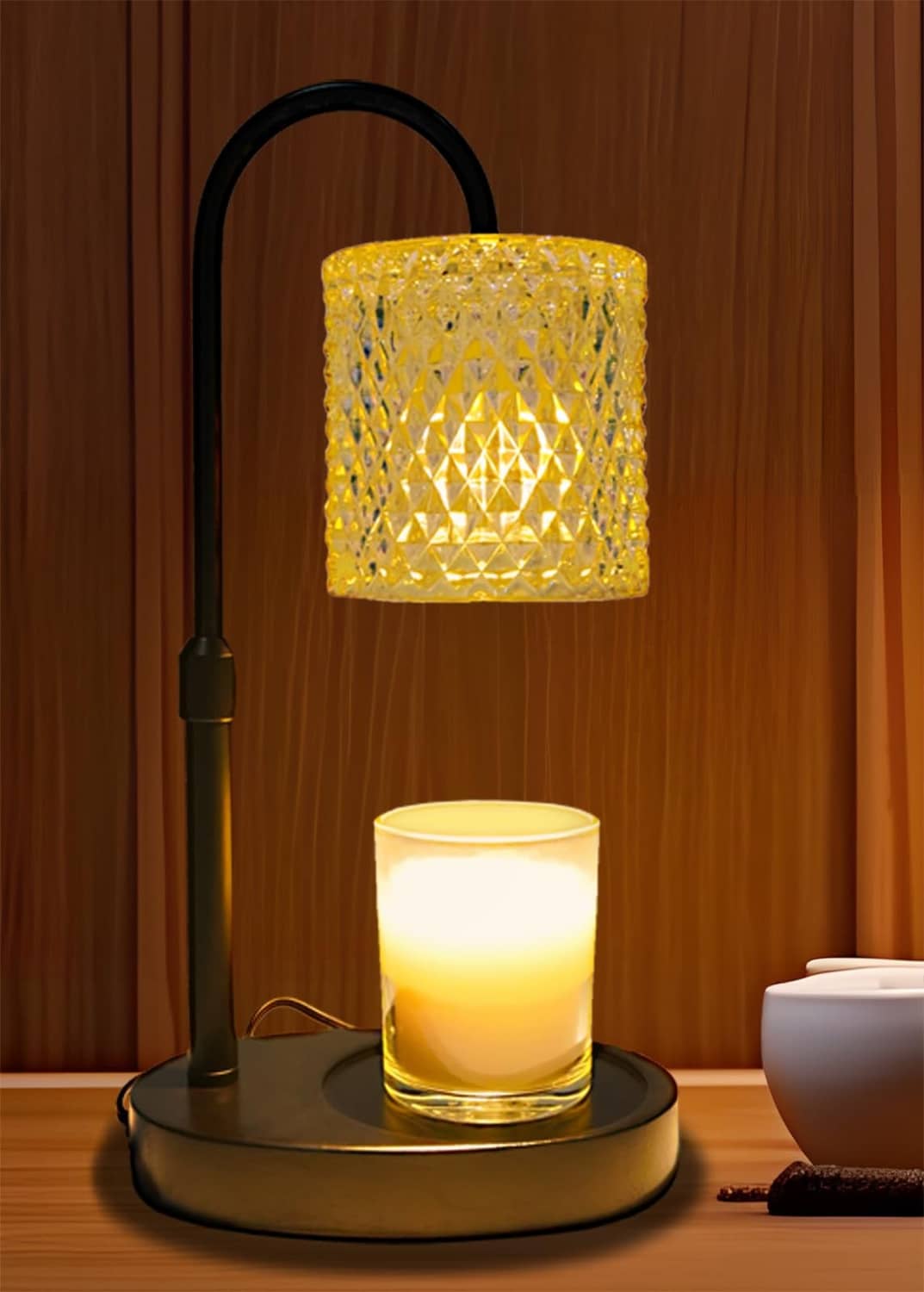 Black candle warmer lamp with amber diamond-pattern lantern shade and lit candle