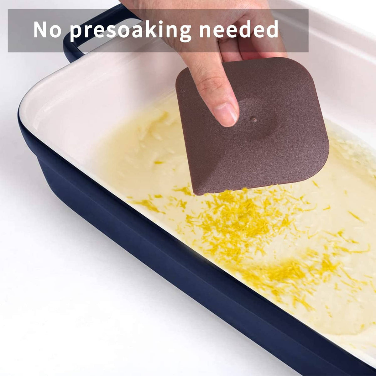 Brown plastic scraper pad used to spread and lift mess from a dish