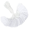 Set of white price tags with attached string, fanned stack of tag cards