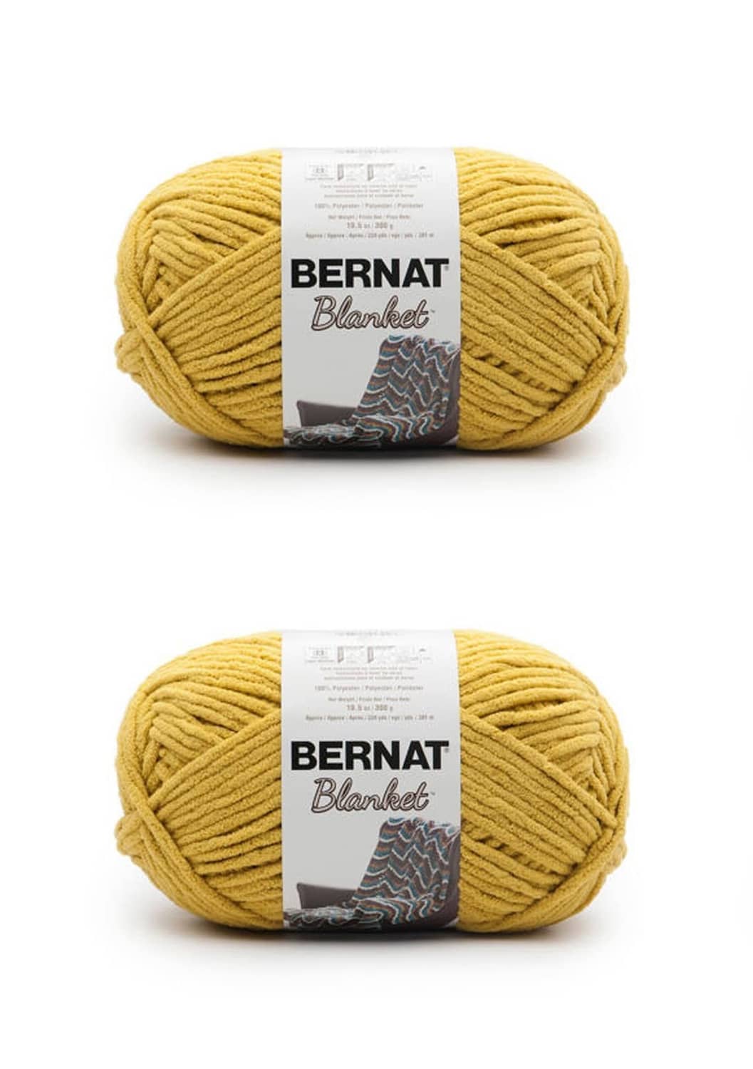 Two yellow Bernat Blanket yarn skeins with labels on a clean background.