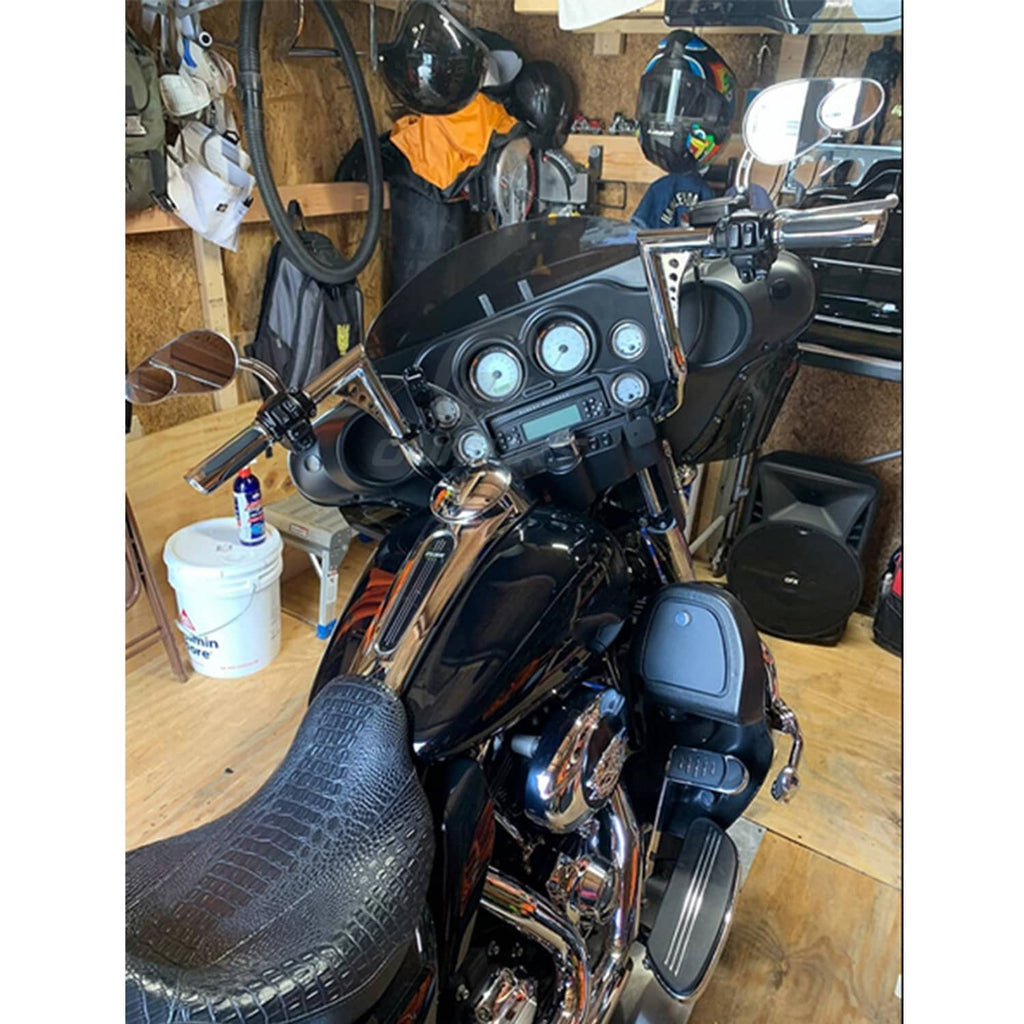 Chrome ape hanger handlebar on black motorcycle dashboard view