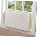 Cream quilted AC cover on window unit, rectangular padded panel