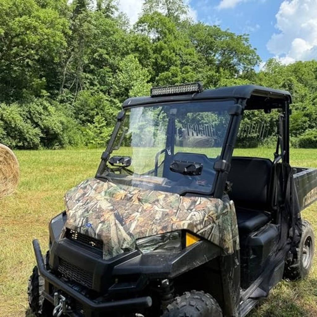 UTV with installed clear vented windshield and black frame surround