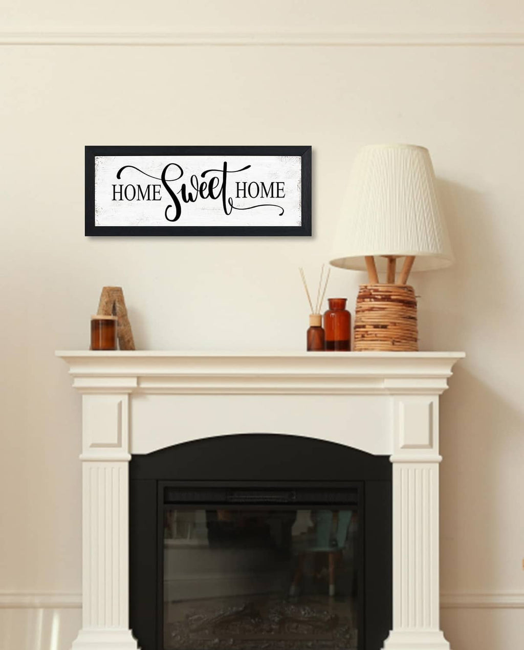 Black-framed “HOME Sweet HOME” wall sign mounted above fireplace mantle