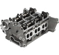 Engine cylinder head with rocker arms, camshaft, and intake/exhaust ports, silver