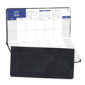 Folded pocket planner open to July 2026 monthly calendar with black cover