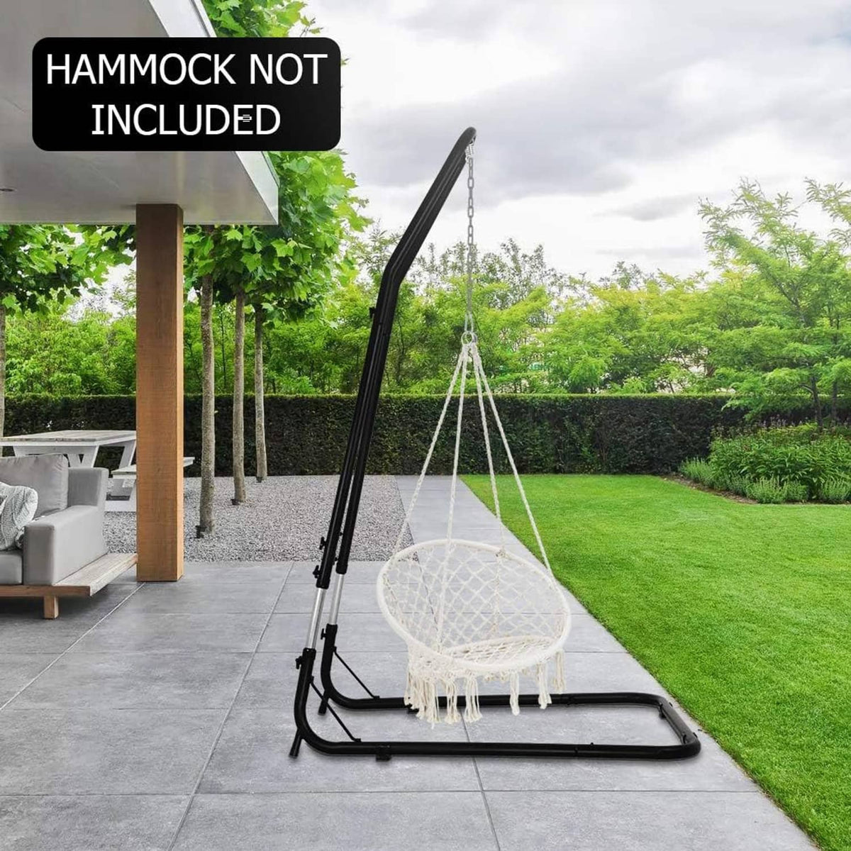 Black hammock chair stand with hanging round net chair suspended from frame