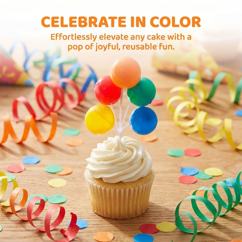 Colorful balloon cake topper on a cupcake with orange, red, green, yellow, blue balloons